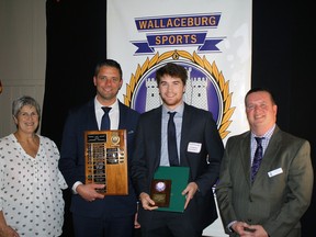 Nolan Dekoning, centre-right, received the Harold Martin Memorial Award for outstanding achievement at the Wallaceburg Sports Hall of Fame ceremony in April 2023. He is shown with Marcia Simpson, hall of fame committee member;  head speaker Andy Fantuz;  and Ed Freeburn, hall of fame committee member.  (Handout/Postmedia Network)