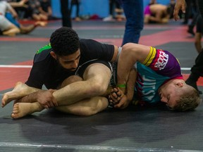 Curran Dixon (bottom) engages his opponent at the 2023 ADCC Canada Open in Ottawa on Sunday, April 24, 2023. Photo by Abrie Kilian.