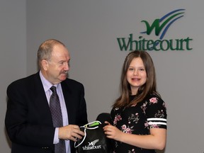 Mayor Tom Pickard presented a swag bag to "Mayor for a Day" Hallie-Jean Robinson, a Grade 6 student at École St. Joseph School, during Monday's council meeting. Robinson won a town contest for the title.