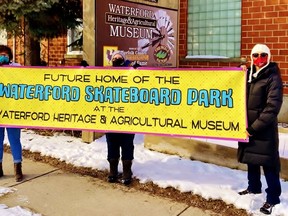 In this file photo from 2021, Waterford Skateboard Park Committee members Kerry Bockenhold, Marlene McCulligh and Denise Jolicoeur unveil a new banner for the Skateboard Park at the Waterford Heritage and Agricultural Museum on Nichol Street. – Contributed photo