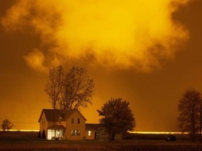 A farmhouse is illuminated by late-night greenhouse lights on Highway 77, north of Leamington, in this Oct. 27, 2020, file photo.  (Dax Melmer/Postmedia Network)