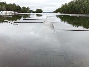 Docks at the Penage Bay Marina are submerged on Monday due to high water levels on Panache Lake.