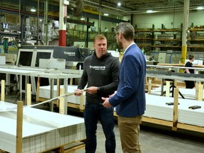 Trusscore chief manufacturing officer Steve Bosman shows Perth-Wellington MPP Matthew Rae around the company's factory in Palmerston, which produces sustainable and long-lasting PVC wall-and-ceiling boards as an alternative to traditional drywall.  (Galen Simmons/The Beacon Herald)