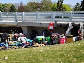Municipal staff continue to monitor a homeless encampment under the Third Street bridge in Chatham. Shown is the site early Tuesday afternoon. (Trevor Terfloth/The Daily News)