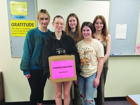 The John Maland High School Claw Crew, from left: Samantha Brown, Darcie Pollock, Siobhan Clyne, Danika Aubin, and Mariana Bruien, with several members not present for the photo. The Claw Crew is running their second annual Hygiene For Hope product drive, from now through May 19. (Dillon Giancola)