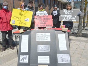 Participants take part in a rally against an Ontario government proposal allowing the licencing of new train and trial hunting dog facilities outside Owen Sound city hall on Wednesday, May 17, 2023. Taking part, from left, are Frank Barningham, Laura Hamel, Jim Ansell, Bobbi Sharpe-Schmidt, Brenda Sharpe, and Michelle Patterson.