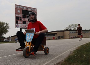 Sadie Frewin, a student at Sarnia's Northern Collegiate, peddles down the track during Friday's Vikes on Trikes fundraiser at the high school.  Paul Morden/The Observer