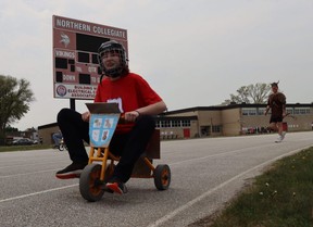 Sadie Frewin, a student at Sarnia's Northern Collegiate, peddles down the track during Friday's Vikes on Trikes fundraiser at the high school. Paul Morden/The Observer