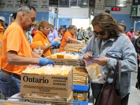 Thousands of people lined up on Monday, May 22 to get bread and cheese at the traditional Victoria Day giveaway in Ohsweken. MICHELLE RUBY/BRANTFORD EXPOSITOR