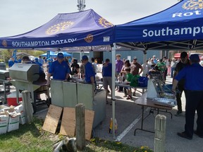 Rotary Club of Southampton members cooked and served at least 600 free hotdogs and 230 pounds of French Fries May 13 at Jubilee Park in Southampton.