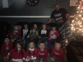 Lucknow resident Dave Donaldson with his 12 children. The Donaldson family lost their home after it caught fire on May 15. Submitted photo.
