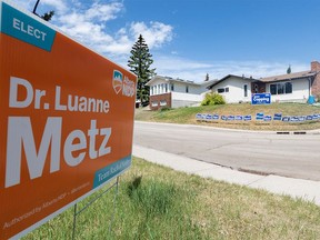 Neighbours in Silver Spring express their political views with yard signs on Tuesday, May 30, 2023. Dr. Luanne Metz defeated Jason Copping in the provincial election yesterday.