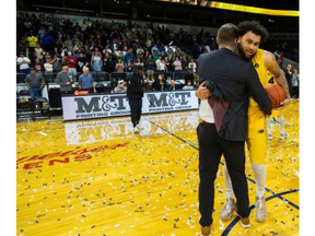 London Lightning head coach Doug Plumb hugs the National Basketball League of Canada finals MVP Jermaine Haley Jr. after they beat the Windsor Express 126-88 to clinch the championship on Friday May 26, 2023. Mike Hensen/The London Free Press