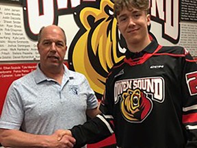 Owen Sound Attack General Manager Dale DeGray with the team's 2023 first-round pick Nico Addy. The Attack announced Wednesday Addy has signed a standard player agreement and committed to the club. Photo courtesy of the Owen Sound Attack