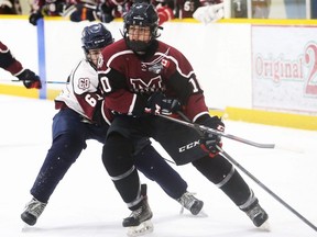 Team Maroon's Aidan Edwards (10) is chased by Team White's Luc Blanchette (61) in the Chatham Maroons' top prospect game at Thames Campus Arena in Chatham, Ont., on Sunday, April 30, 2023. Mark Malone/Chatham Daily News/Postmedia Network