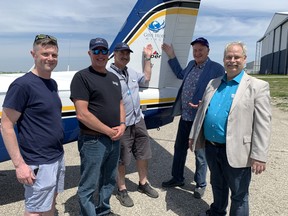 Jon Collins, left, the chief development officer of Hope Air; local co-organizers of the 'Eastern Expedition' John Thompson and Ed Johnston; Mayor Kevin Davis; and Coun. Greg Martin were supporting a fundraiser for Hope Air Saturday that drew dozens of small planes to the Brantford Airport.