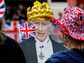 A cardboard picturing Britain's King Charles III with Union Jack is pictured along the procession route on The Mall, near to Buckingham Palace in central London, on May 5, 2023, ahead of the coronation weekend. (Photo by ODD ANDERSEN/AFP via Getty Images)