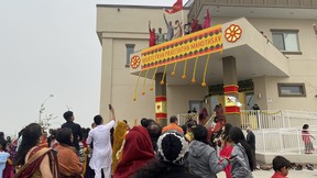 A flag is raised at the Sanatan Mandir Cultural Society in Fort McMurray to celebrate Fort McMurray's first Hindu temple on May 22, 2023. Vincent McDermott/Fort McMurray Today/Postmedia Network