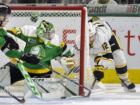 Easton Wainwright of the Sarnia Sting nearly tucks home a wraparound attempt on London Knights goalie Brett Brochu in Game 2 of their OHL Western Conference championship series. Brochu later left the game with an apparent injury. Photo taken on Sunday April 30, 2023. (Mike Hensen/Postmedia Network)