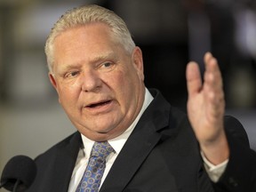 Premier Doug Ford, in London Wednesday to unveil two auto-sector training and job placement programs, is defending his government's move to put more money into a Windsor electric-vehicle battery plant. (Mike Hensen/The London Free Press