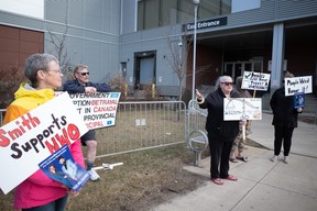 Supporters of ousted UCP candidate Zulkifl Mujahid protest outside a fundraising dinner hosted by Premier Danielle Smith at Shell Place on April 28, 2023. Vincent McDermott/Fort McMurray Today/Postmedia Network