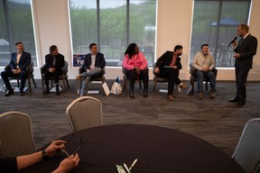 L-R: UCP candidate Brian Jean, Independent candidate KDM Kevin Johnston, UCP candidate Tany Yao, Independent candidates Funky Banjoko and Zulkifl Mujahid, and Alberta Party candidate Brad Friesen listen to Jon Tupper of Mix 103.7 FM at the Fort McMurray Golf Club during an all-candidates forum on May 23, 2023. Vincent McDermott/Fort McMurray Today/Postmedia Network