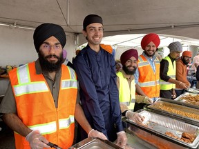 Men are often found serving the meal of abundance on Khalsa Day, welcoming Sikhs from far and wide along with visitors to the festive event which drew thousands for the food and a parade through the streets of Brantford on Sunday, May 14. SUSAN GAMBLE/BRANTFORD EXHIBITOR