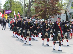 The Royal Canadian Legion Branch 163 Pipes and Drums from Hamilton leads the parade on Monday, May 22 at the Six Nations of the Grand River Bread and Cheese celebrations.  MICHAEL RUBY