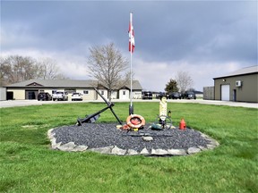 The memorial to Maxine Scratch in the front of Johnston Net and Twine in Wheatley. At the left of the memorial, is the ship's anchor, which Doug Johnston found on the bottom of Lake Erie. Photo by John Martinello.