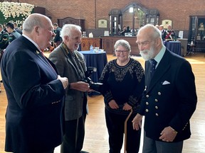 His Royal Highness Prince of Michael of Kent, right, shares a laugh with Major (Ret.) Greg Childs of the Essex and Kent Scottish Regiment, left, Spike Bell, and Carol Childs (UE) during a gathering at the Chatham Armory building on Sunday following a Freedom of the City exercise at the Civic Center in downtown Chatham.  PHOTO Ellwood Shreve/Chatham Daily News