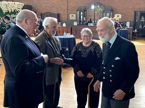 His Royal Highness Prince of Michael of Kent, right, shares a laugh with Major (Ret.) Greg Childs of the Essex and Kent Scottish Regiment, left, Spike Bell, and Carol Childs (UE) during a gathering at the Chatham Armory building on Sunday following a Freedom of the City exercise at the Civic Center in downtown Chatham. PHOTO Ellwood Shreve/Chatham Daily News