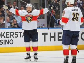 Defenceman Brandon Montour, left, of the Florida Panthers celebrates a goal against the Toronto Maple Leafs during Game 1 of their Eastern Conference semifinal.