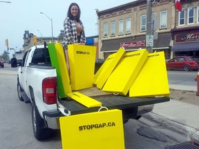 Fifteen portable entrance ramps were recently delivered to downtown Clinton businesses in an effort to improve accessibility. Pictured delivering the ramps is Alicia Coxen. Handout
