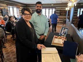 Maison Baldwin House executive director Debbie Fortier, signing the city’s Book of Recognition and pictured with Cornwall Mayor Justin Towndale. Photo on Friday, May 19, 2023, in Cornwall, Ont. Todd Hambleton/Cornwall Standard-Freeholder/Postmedia Network