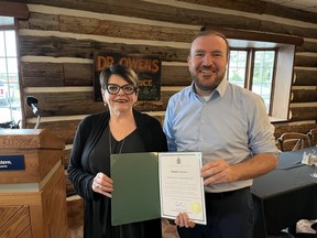 Maison Baldwin House executive director Debbie Fortier, receiving congratulations from SDSG MP Eric Duncan. Photo on Friday, May 19, 2023, in Cornwall, Ont. Todd Hambleton/Cornwall Standard-Freeholder/Postmedia Network