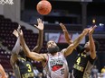 Windsor Express forward Justin Moss, centre, battles London Lightning centre Kur Jongkuch, left, and guard Jeremiah Mordi during Game 3 of the NBL of Canada finals at the WFCU Centre in Windsor on Tuesday May 23, 2023. Dan Janisse/Windsor Star