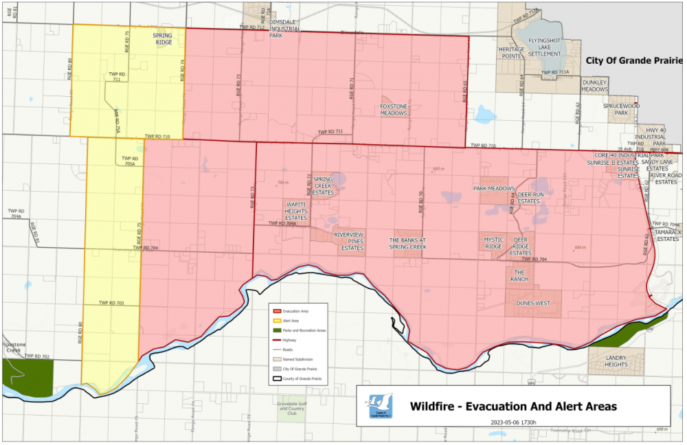 Grande Prairie county and city and Alberta firefighters battle and