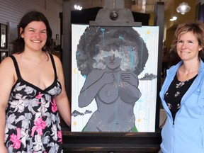 Student and artist Skye Hunt and her mother, Chantel, with Skye's work, In Celebration of the Mother. The painting was ordered removed from the Earth Day display at Gananoque Intermediate and Secondary School.