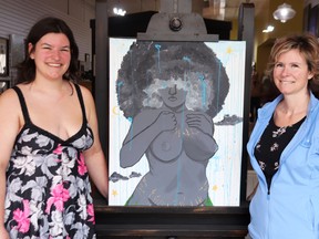 Student and artist Skye Hunt and her mother, Chantel, with Skye's work, In Celebration of the Mother. The painting was ordered removed from the Earth Day display at Gananoque Intermediate and Secondary School.