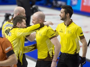 London ON.March 11, 2023.Budweiser Centre.Tim Hortons Brier.Manitoba skip Matt Dunstone celebrates  with3rd.B.J.Neufeld, 2nd.Colton Lott, lead Ryan Harnden,  after defeating Wild Card 1,7-5 to advance to Sunday night's Brier final against team Canada.