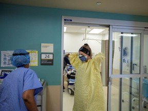 Emergency room nurses suit up at Humber River Hospital in Toronto in 2022.