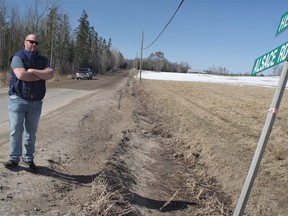 Joseph Bell on the Alsace Boundary Road in Nipissing Township.  Bell says the potholes disappeared after the road was gravelled and graded over.  But Bell says they'll be back after rain washes the gravel away.  Bell and his neighbours say the solution is to resurface the road and return it to a hard surface state before the municipality pulverized it last summer. Rocco Frangione/Local Journalism Initiative