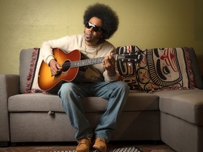 Alex Cuba with guitar