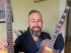 A week after they were stolen from his van, Tom Savage is celebrating the return of his Epiphany Wildkat and Gibson Nighthawk guitars. He doesn't know where they spent the week, but is thankful for their safe return. He's pictured in his Kingston home on Saturday.