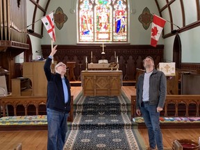 Huron Waves Music Festival artistic director John Miller, left, and conductor Mark Vuorinen stand in Trivitt Memorial Anglican Church in Exeter and look up where a large rotating balloon six metres in diametre representing Earth will hang during the upcoming GAIA exhibit.