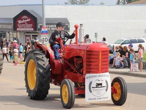Cohen Tomkiewych rode a tractor through main street Mayerthorpe; Tony Tomkiewych organized Tomkiewych Farms' entries into the Fairthorpe parade. The farm is south of Mayerthorpe.