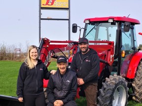 Joe Piekarski Senior flanked by his son Joe Piekarski Junior.  Father and son own and operate J and J Equipment Repair in Powassan.  Piekarski's daughter Jennifer St. George recently joined the family business as an administrator.  The business is celebrating 20 years of service and is holding a Demo Days where people can see antique tractors ploughing a field as well as horse ploughing and also try out the various farm equipment on the Piekarski property before buying it. Kathie Hogan photo