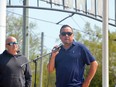 Saugeen First Nation Chief Conrad Ritchie addresses the crowd during a community beach party at Sauble Beach on Sunday, May 21, 2023. Looking on is band administrator Gerry Glover.