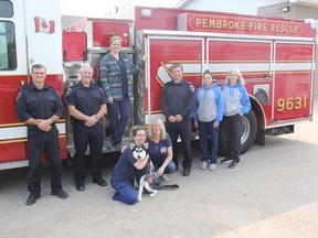 The Ontario SPCA and Humane Society has partnered with the Ontario Association of Fire Chiefs and is offering free emergency decals to be placed on the front door of homes indicating the number of pets living inside to alert first responders in an emergency. In the photo from left, Pembroke firefighters Darrell Andrews and Ian Caughey, Kate Graham (Ontario SPCA animal care co-ordinator), April Sereda-Ashcroft (registered veterinary technician) holding Raven, Heather Jobe (Ontario SPCA community outreach coordinator), Pembroke Fire Department Acting Captain Jason Kelly, Stacy Boucher (Ontario SPCA animal care attendant), and Carol Boudreau (Ontario SPCA Renfrew County Animal Centre interim manager). Anthony Dixon