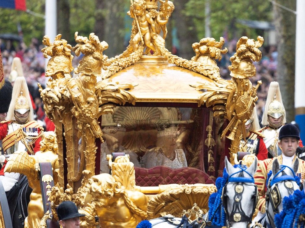  the royal golden carriage carrying king charles the iii and queen camilla heads down the mall after the coronation. joshua bratt/pool via reuters